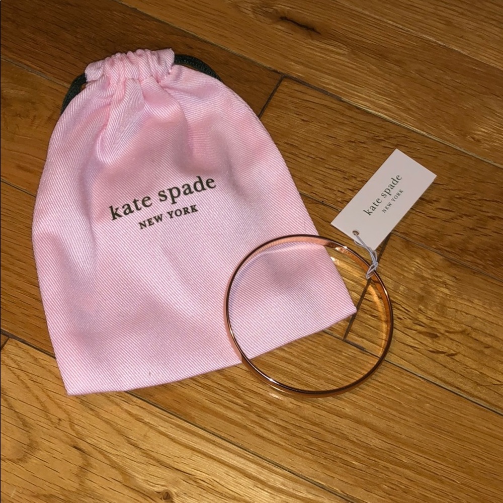 KATE SPADE bracelet $ pink bag.